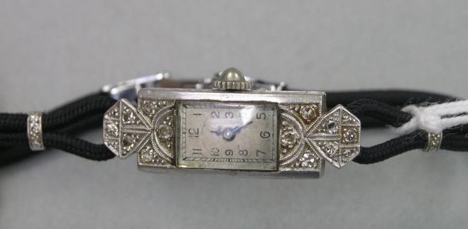 Appraisal: A lady's Art Deco platinum and diamond mounted cocktail watch