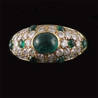 Appraisal: An emerald and diamond ring by Cartier centred with an