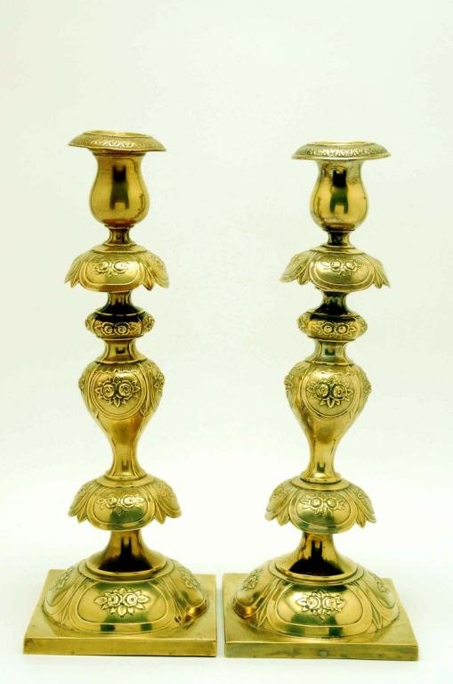 Appraisal: Pair of brass over base metal candlesticks consisting of ornate