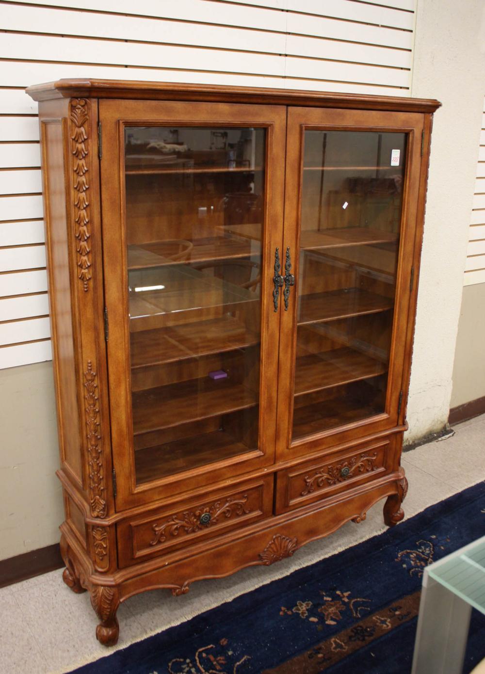 Appraisal: DOUBLE-DOOR CABINET BOOKCASE antique reproduction having eight adjustable wood shelves