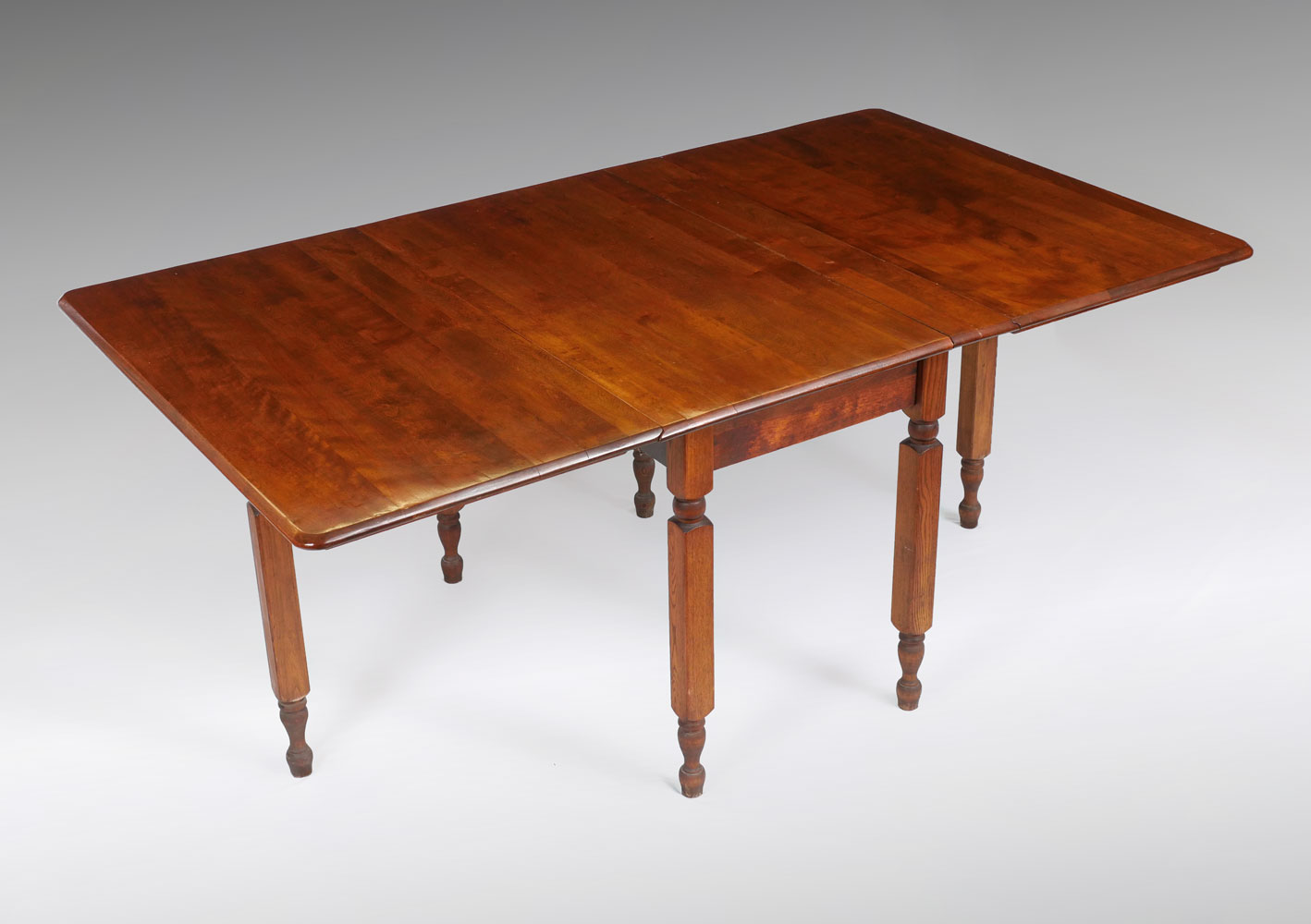 Appraisal: AMERICAN WALNUT DROP LEAF TABLE CIRCA Circa American double drop