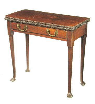 Appraisal: A mahogany card table the fold over top baize lined