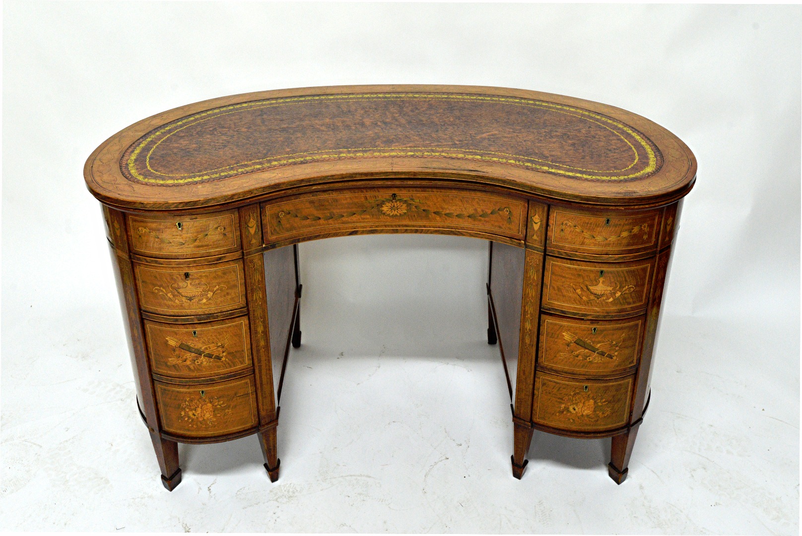 Appraisal: A late Victorian inlaid mahogany and rosewood kidney shape writing