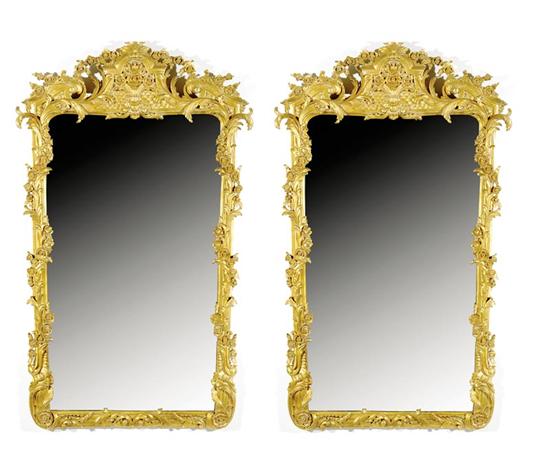 Appraisal: Pair Continental carved giltwood wall mirrors scrolling molded frames draped