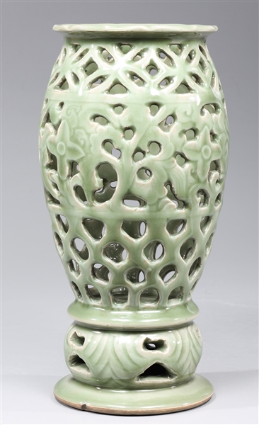 Appraisal: Chinese celadon glazed vase with openwork throughout body and base