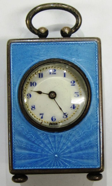 Appraisal: A silver cased and pale blue enameled miniature clock the