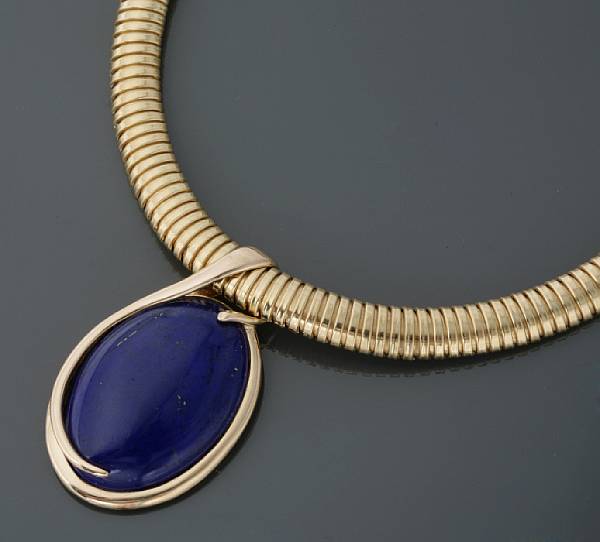 Appraisal: A lapis lazuli and gold slider with necklace flexible tubagas