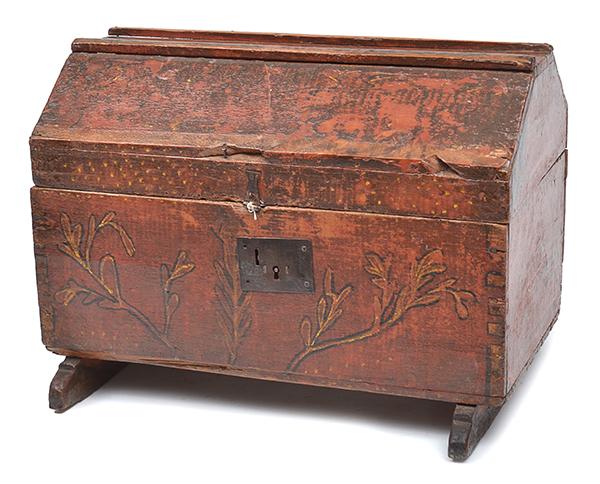 Appraisal: A SPANISH RED PAINTED DOMED TOP CHEST painted with leafy