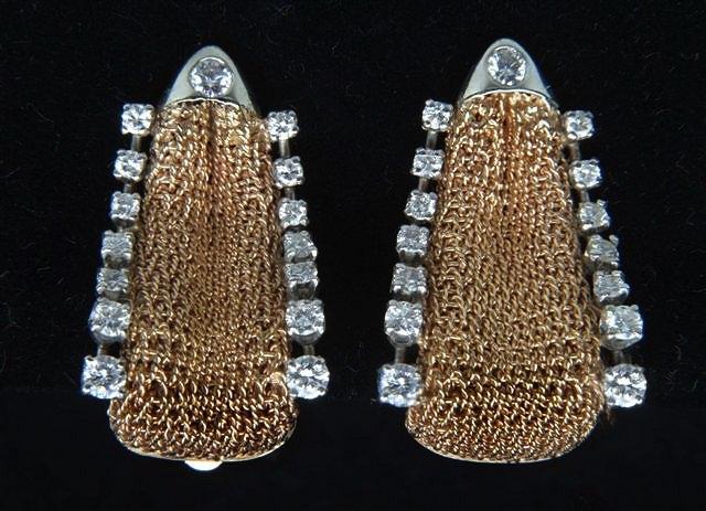 Appraisal: A PAIR OF CONTEMPORARY DIAMOND SET EAR CLIPS with a