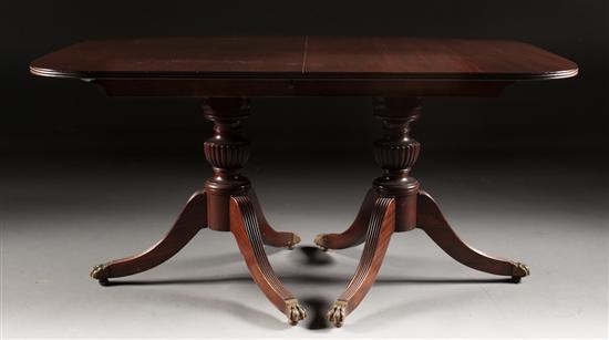 Appraisal: Federal style carved and reeded mahogany double pedestal dining table