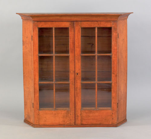 Appraisal: Pennsylvania tiger maple hanging cupboard early th c with canted