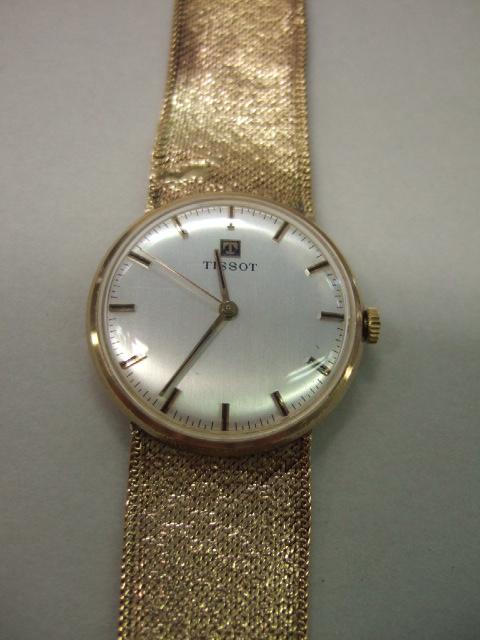 Appraisal: A gentleman's ct gold Tissot bracelet wristwatch the signed circular