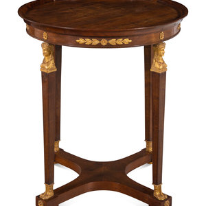 Appraisal: An Empire Style Parcel Gilt Mahogany Side Table th Century