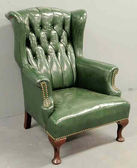 Appraisal: Queen Anne style green leather wing chair h x w