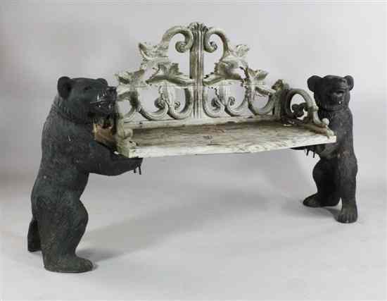 Appraisal: A painted bronze and carved wood garden bench decorated with