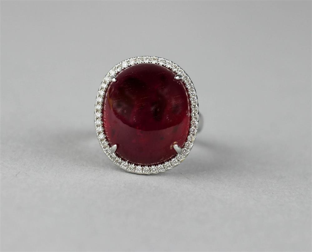 Appraisal: LADY'S RED-COLORED STONE AND DIAMOND CABOCHON COCKTAIL RING the oval