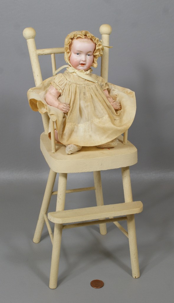 Appraisal: German Bisque Baby doll in wooden chair Head incised B