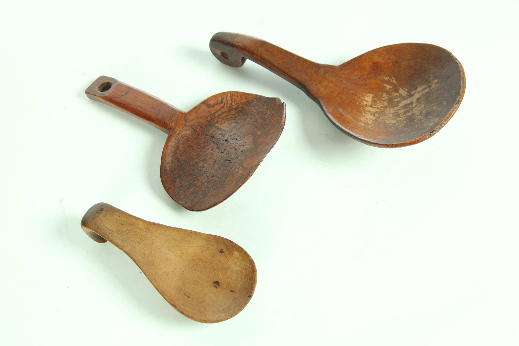 Appraisal: THREE BUTTER PADDLES American th century Burl chip ''l and