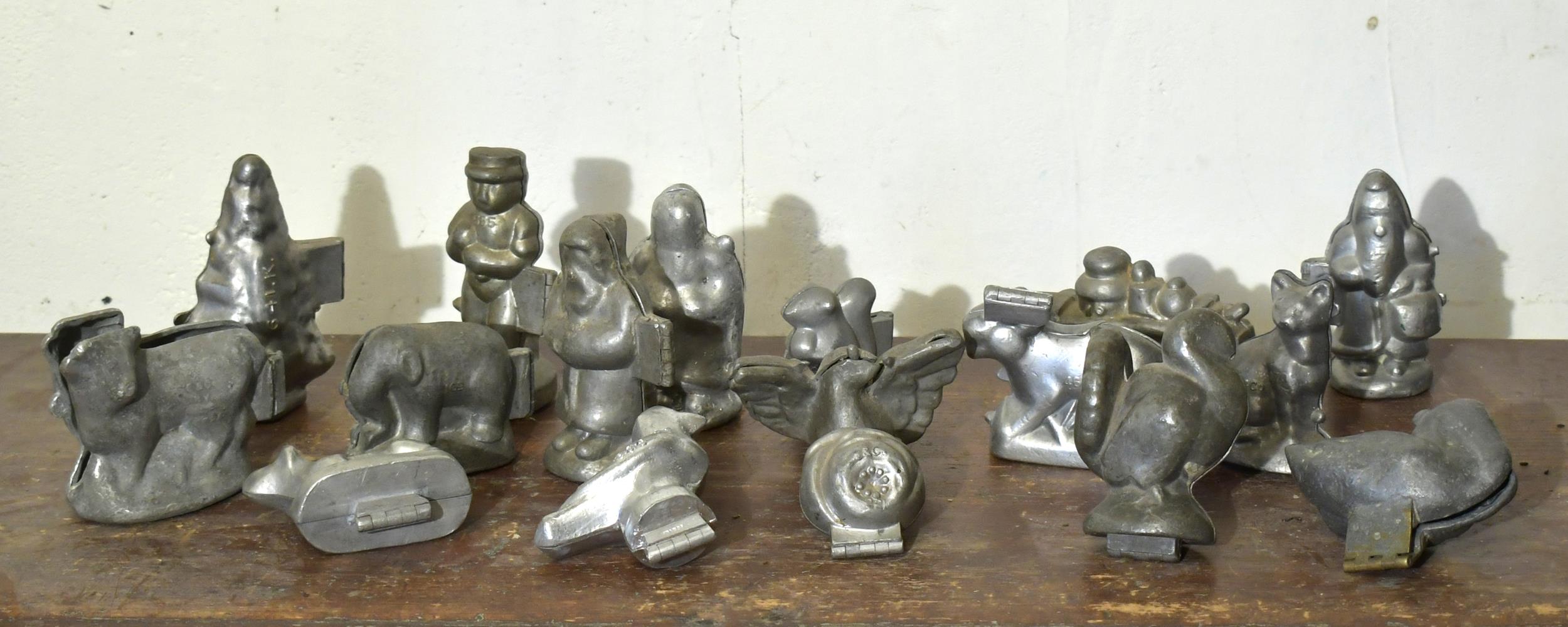 Appraisal: VINTAGE PEWTER CHOCOLATE MOLDS Figural animal tree and train form