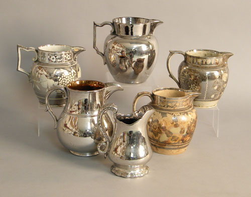 Appraisal: Six silver resist pitchers th c tallest