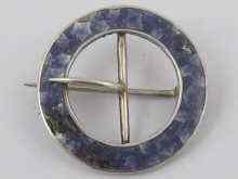 Appraisal: A small circular Russian silver buckle brooch with a ring