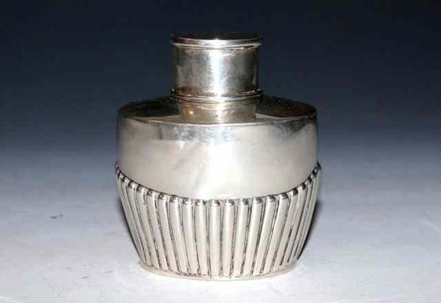 Appraisal: A LATE VICTORIAN OVAL SILVER TEA CADDY with a fluted