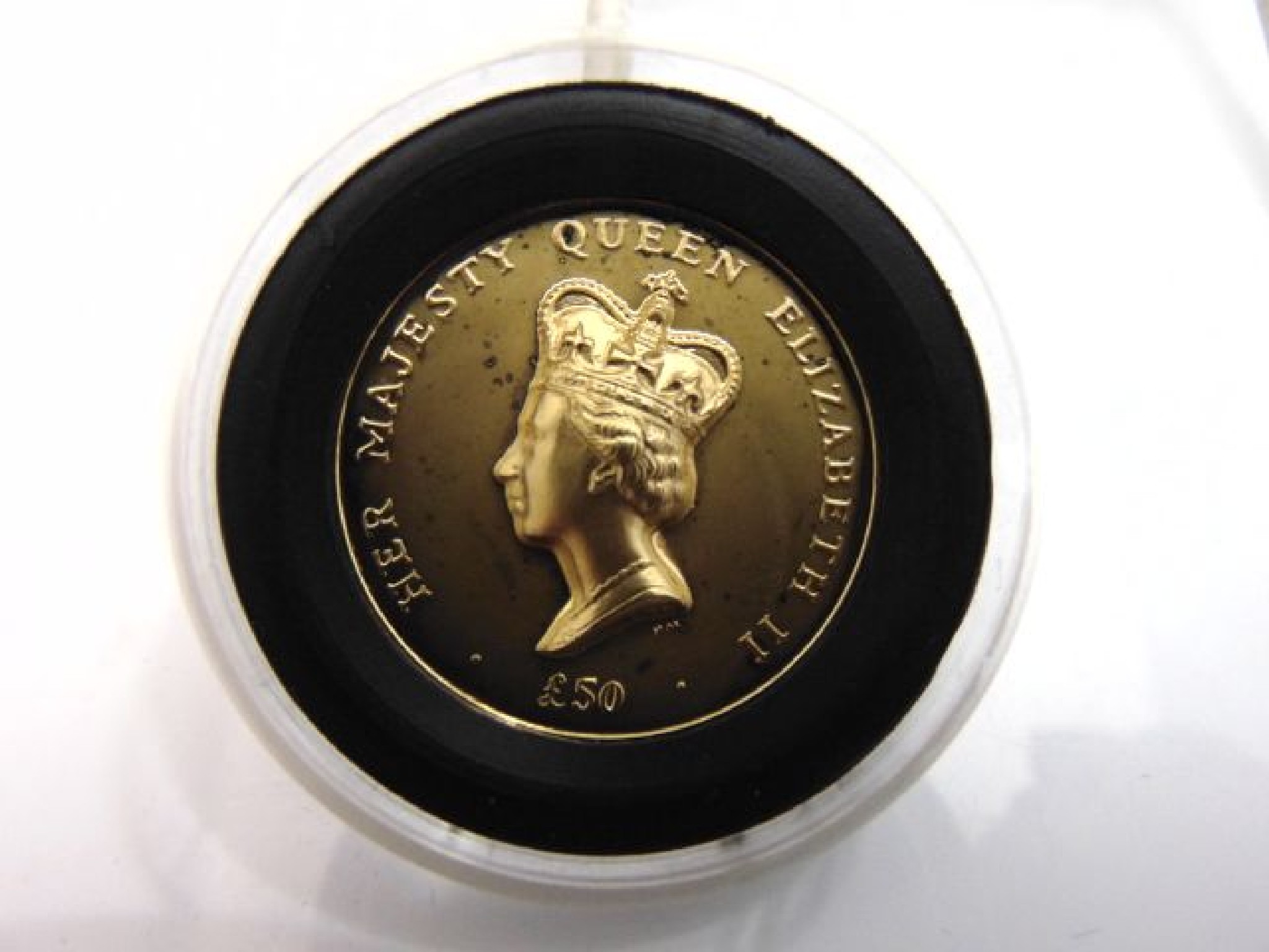 Appraisal: A high Relief Queen's Portrait Gold Proof Coin fitted display