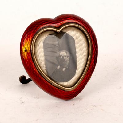 Appraisal: An Austrian silver and enamel heart-shaped photo frame Georg Adam