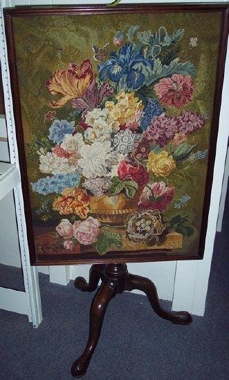 Appraisal: A needlework fire screen the rectangular panel on a tripod