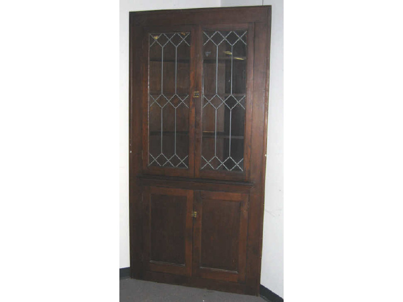 Appraisal: AMERICAN PINE ARCHITECTURAL CORNER CUPBOARD Showing a pair of leaded