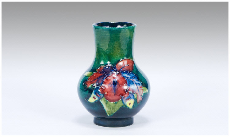 Appraisal: Moorcroft Small Vase Orchids on Green Blue Ground Marks to