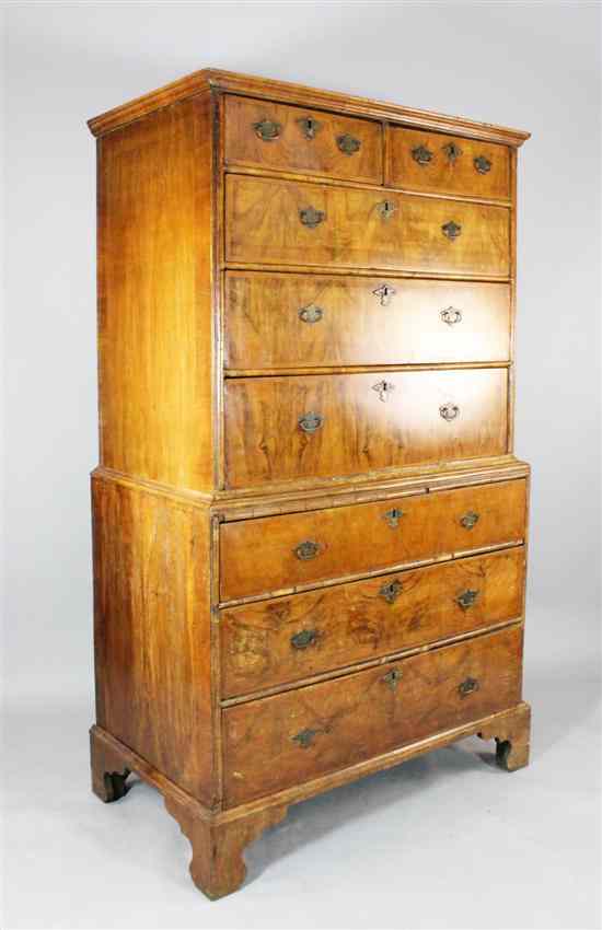 Appraisal: An early th century feather banded walnut chest on chest