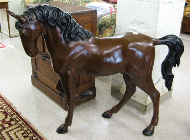 Appraisal: A LARGE EQUESTRIAN BRONZE SCULPTURE the half-size figure of a