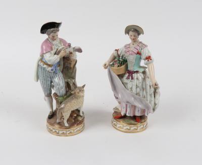 Appraisal: Two Meissen figures circa she holding basket of flowers and