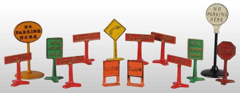 Appraisal: Lot of Cast Iron Road Sign Toys Description American Includes