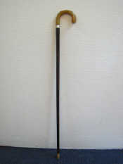 Appraisal: A hardwood believed coromandel walking stick with moulded horn handle