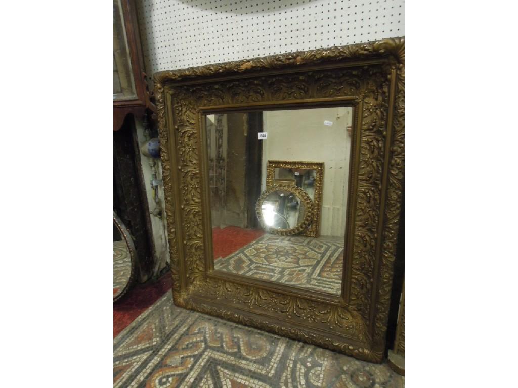 Appraisal: A gilt framed wall mirror of rectangular form with bevelled