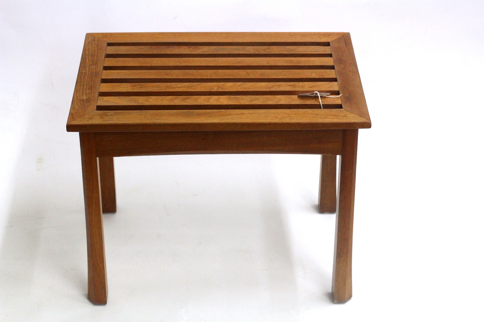 Appraisal: A walnut luggage stand by Brynmaw Furniture the rectangular slatted