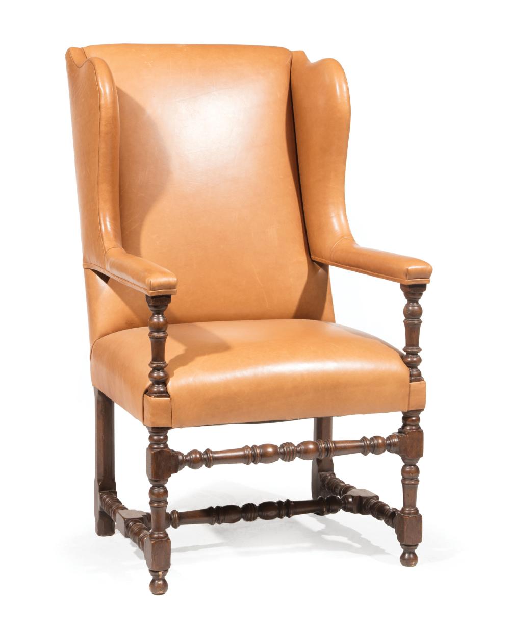 Appraisal: Louis XIII-Style Walnut Fauteuil a Oreilles leather back and seat