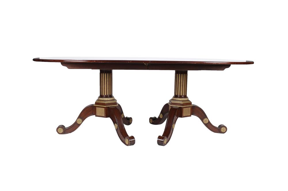 Appraisal: EMPIRE STYLE GILT METAL-MOUNTED MAHOGANY DINING TABLEwith three extensions with