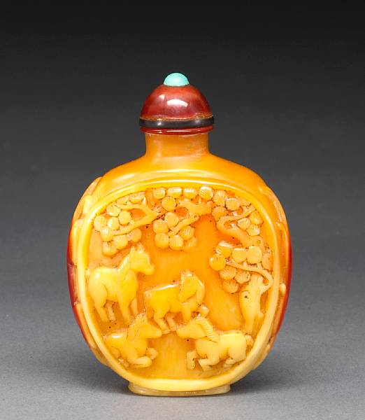 Appraisal: A hornbill snuff bottle The well-hollowed bottle carved to each