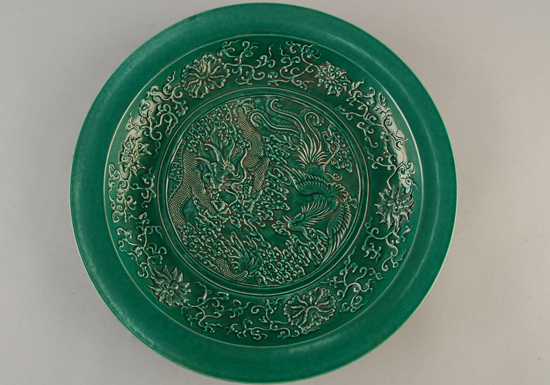 Appraisal: th C Chinese Carved Green Glazed Charger w dragon and