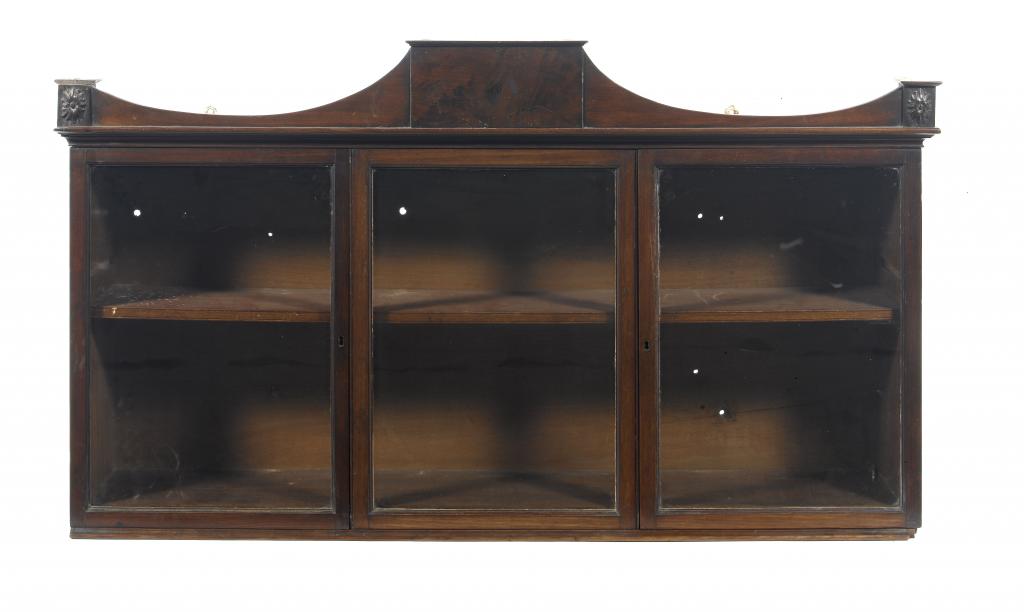 Appraisal: A REGENCY MAHOGANY CABINET the pediment with figured tablet and