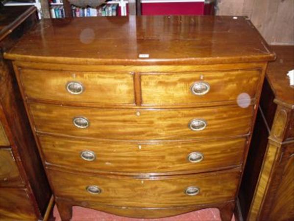 Appraisal: A Regency mahogany bowfront chest of two short and three