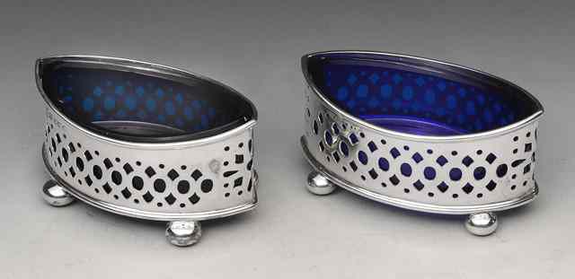 Appraisal: A PAIR OF VICTORIAN BOAT SHAPED SALTS with pierced sides