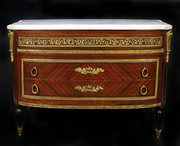 Appraisal: A Louis XVI style marble topped commode height in length