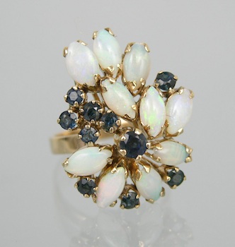 Appraisal: A Sapphire and Opal Dinner Ring k yellow gold ring