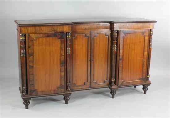 Appraisal: A Regency rosewood inverted breakfront cabinet on turned feet ft