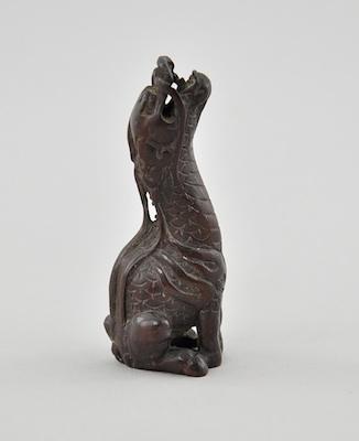 Appraisal: Trumpeting Kirin Wood Netsuke In the form of one of