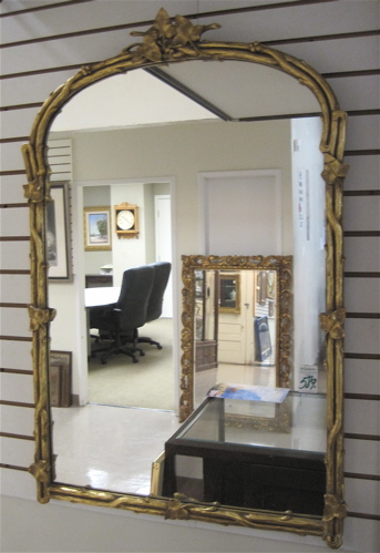 Appraisal: A HEAVY ARCHED TOP WALL MIRROR Wood with branches and